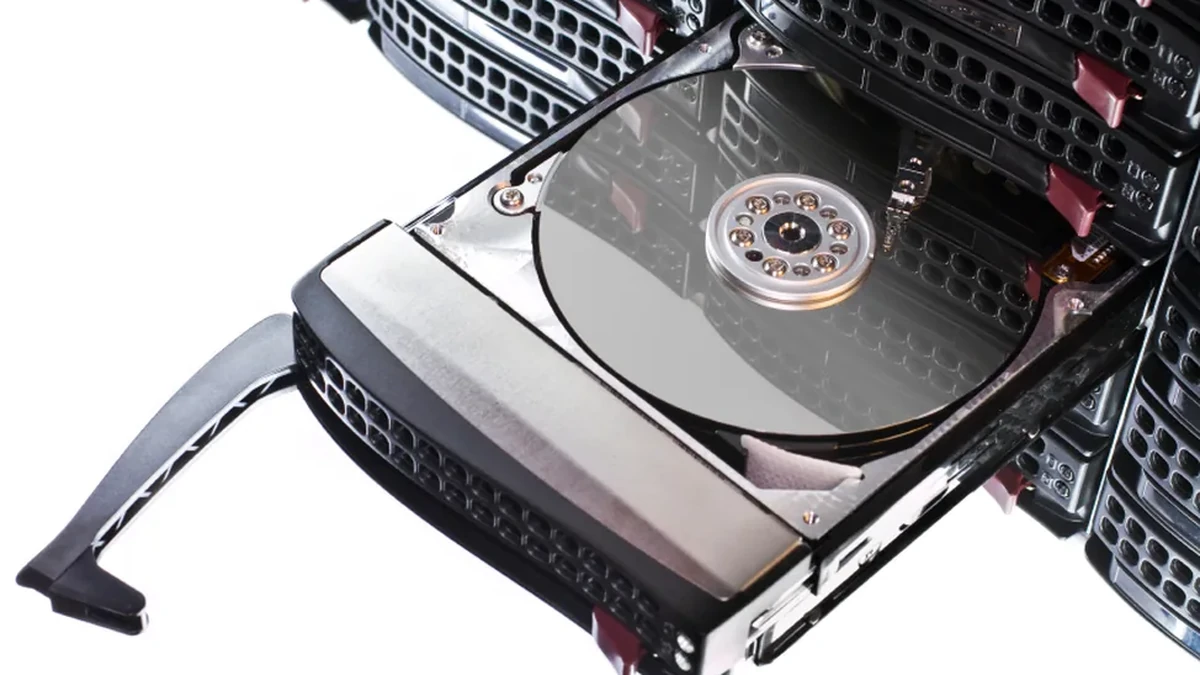 RAID server hard drive being removed from a rack-mounted enclosure